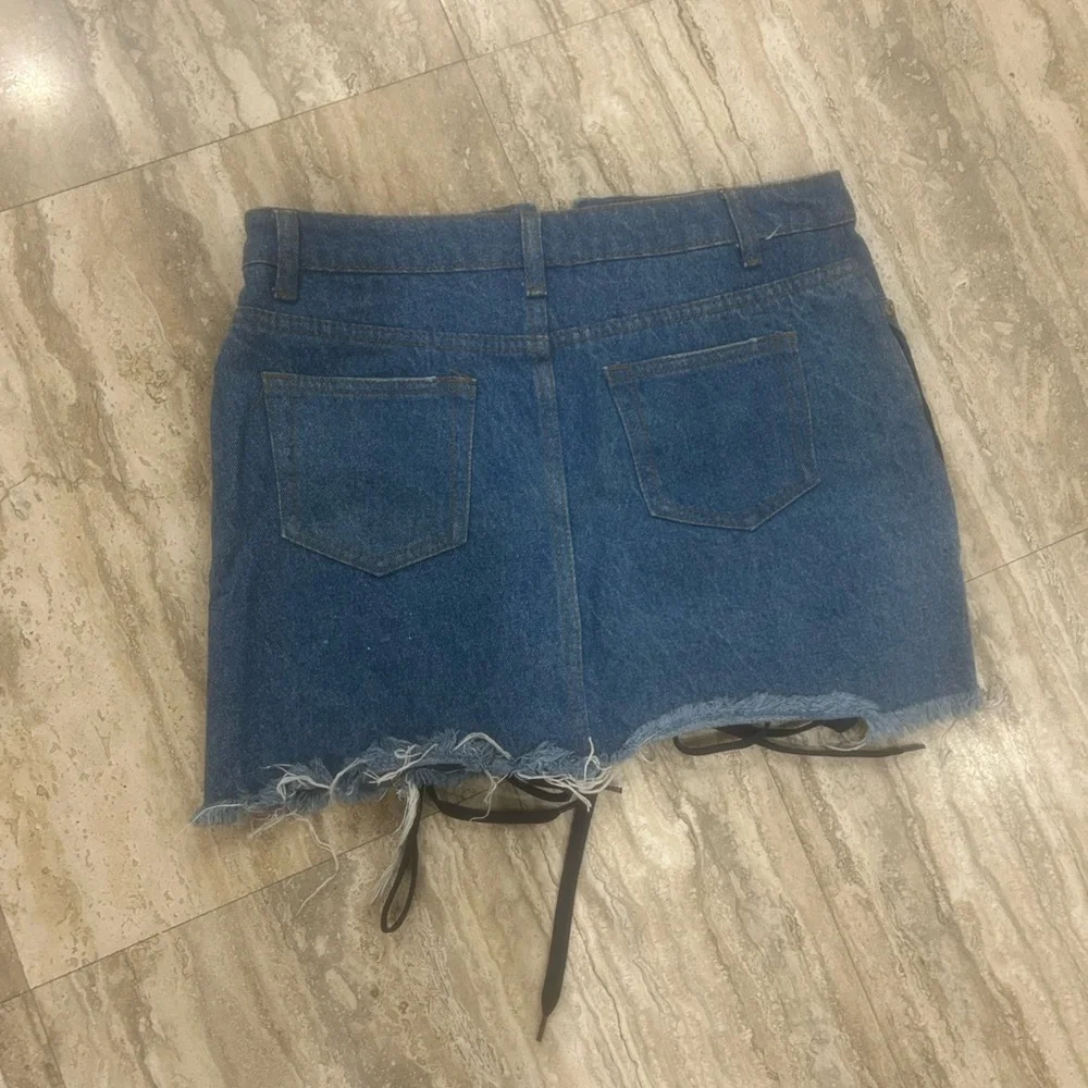Denim Skirt with Lace-Up Detail fits like a medium